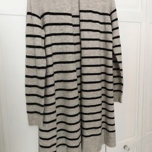 Long, tunic length cardigan sweater.